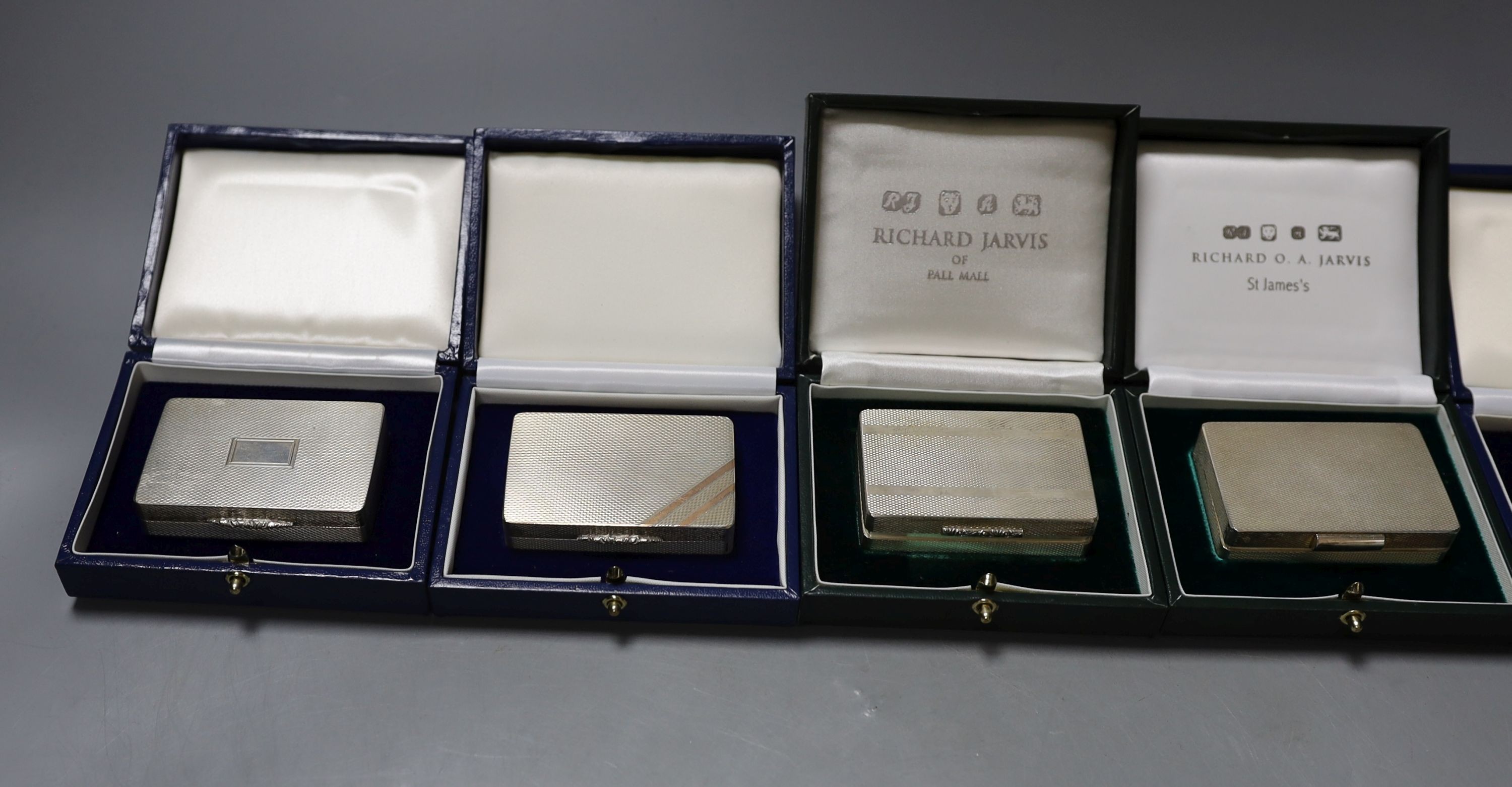 Six assorted modern cased silver or parcel gilt silver pill boxes, by Peter John Doherty, London, 2000-2005 and one Edinburgh, largest 65mm, all in fitted Gallagher boxes.